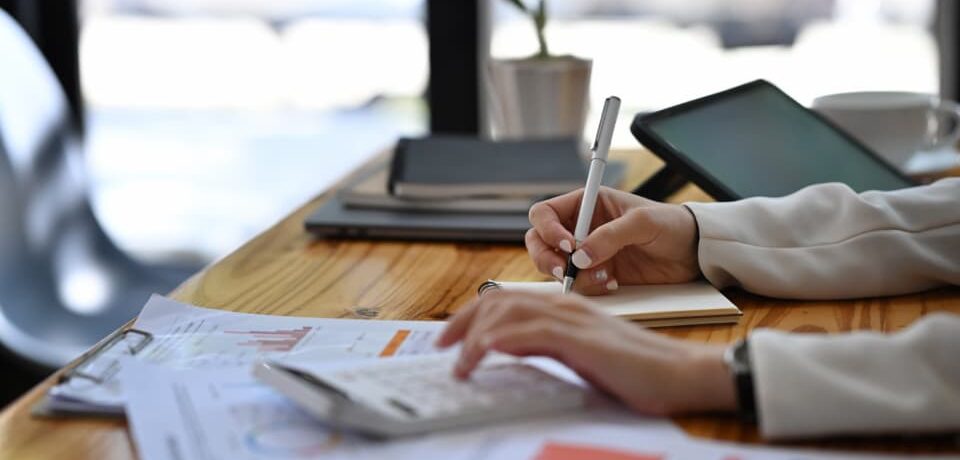 close-up-view-businesswoman-writing-information-on-2024-11-30-03-43-53-utc