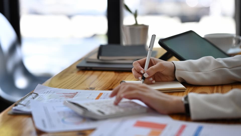 close-up-view-businesswoman-writing-information-on-2024-11-30-03-43-53-utc